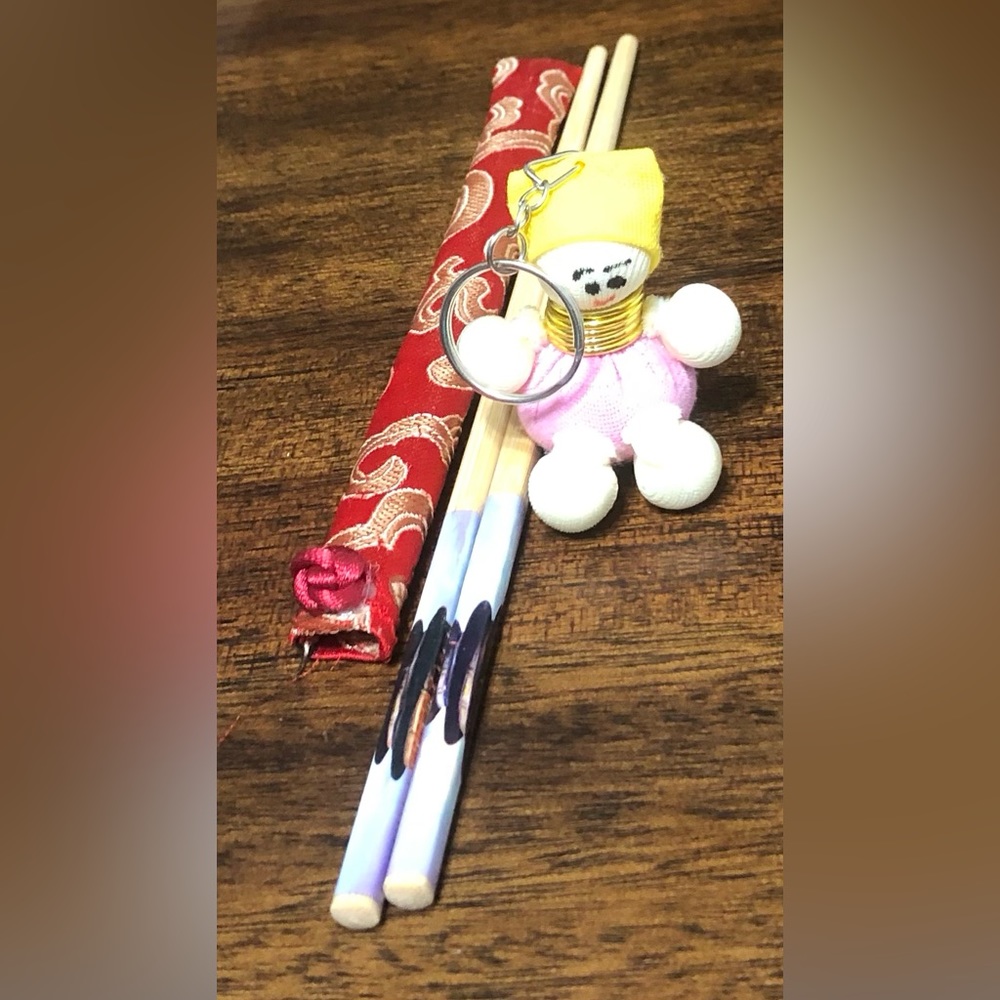 Key chain cloth doll And wood chop sticks.
